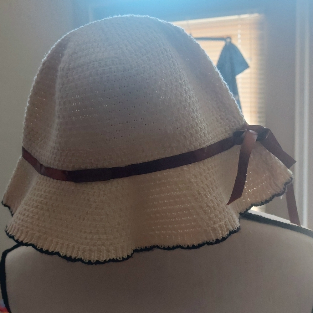 Get ready for the sun with this Chic Cream Sun Hat with Brown Ribbon